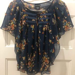 Floral blouse with button detail.